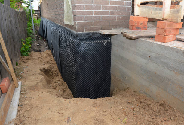 SJ Waterproofing Pros technician performing targeted Interior Drainage System assessment in Elgin, SC